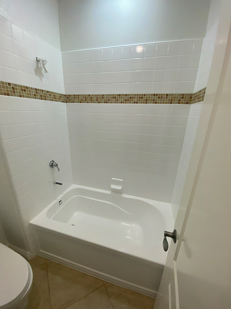Refinished bathtub surface in a Chula Vista home bathroom