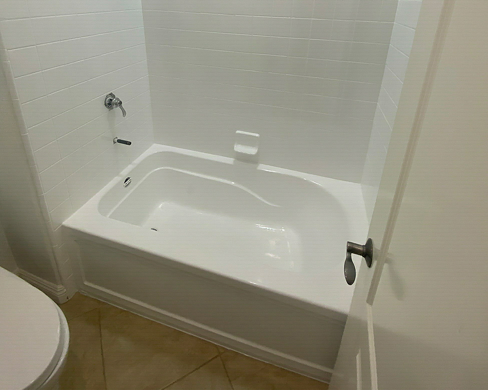 Refinished bathtub surface in an Oceanside home bathroom
